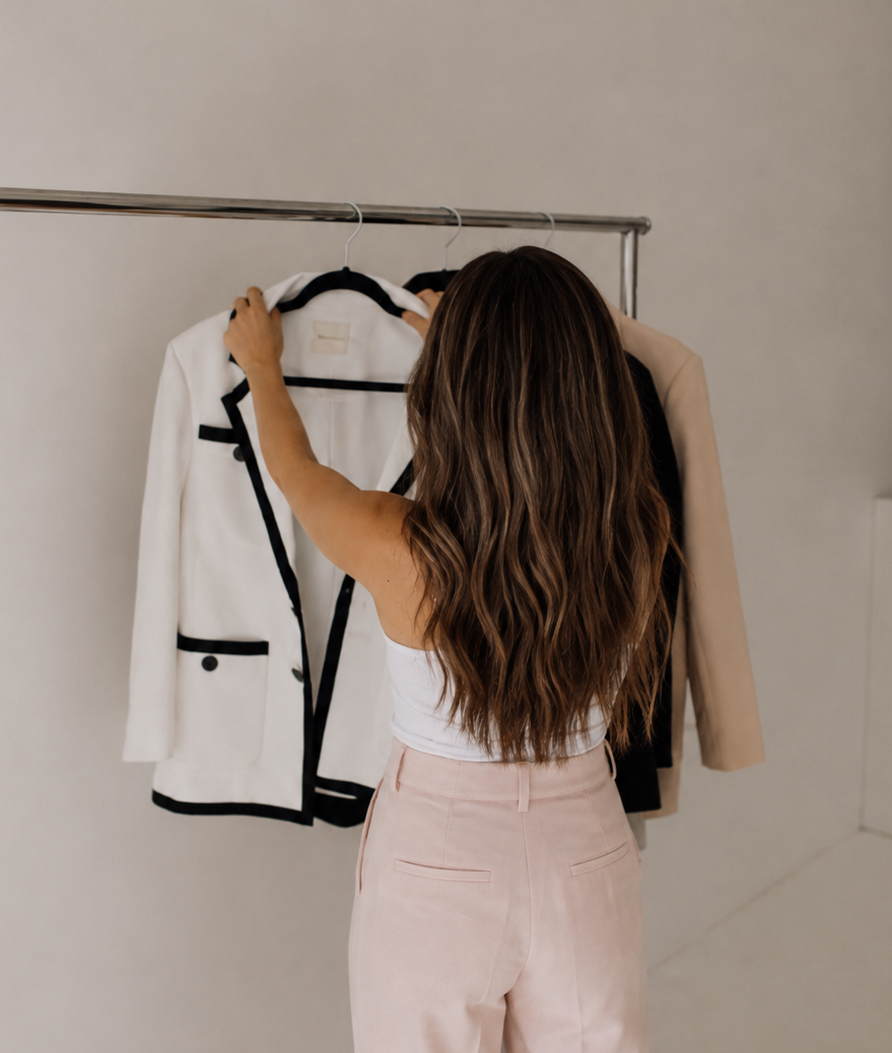 Personal stylist helping a client choose outfits during a Denver personal styling session